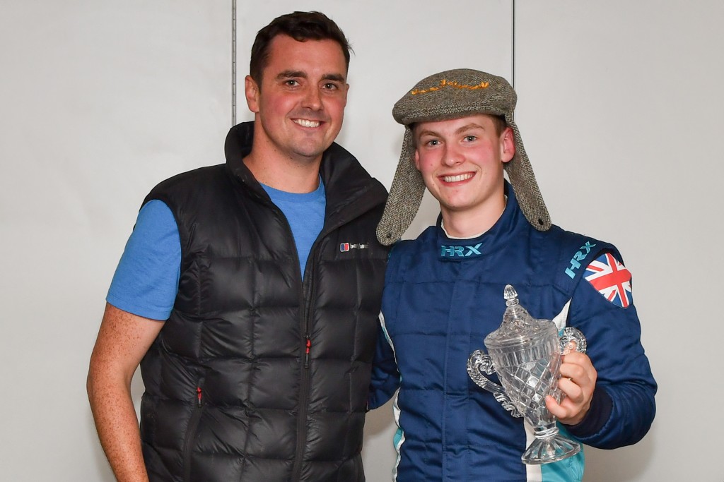 Drew Cameron presenting the Alan Cameron Memorial Race Trophy plus silly hat