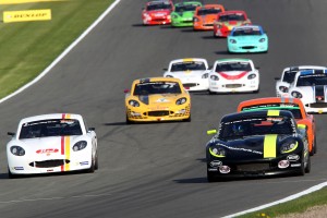 Jack Rawles leading a pack of juniors down the start finish straight at Donington