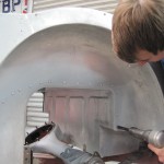 Bill Rawles builds a perfect under-body tub onto the chassis and hand-rivets perfectly finished outer panels onto it