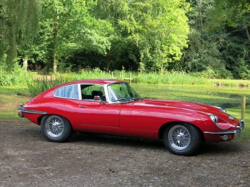 Jaguar E-Type Series 2. For sale at Bill Rawles Classic Cars Ltd. Red exterior and black trim running on chrome wire wheels just complements the whole appearance