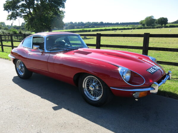 Jaguar E-Type Series 2. For sale at Bill Rawles Classic Cars Ltd. Red exterior and black trim running on chrome wire wheels just complements the whole appearance